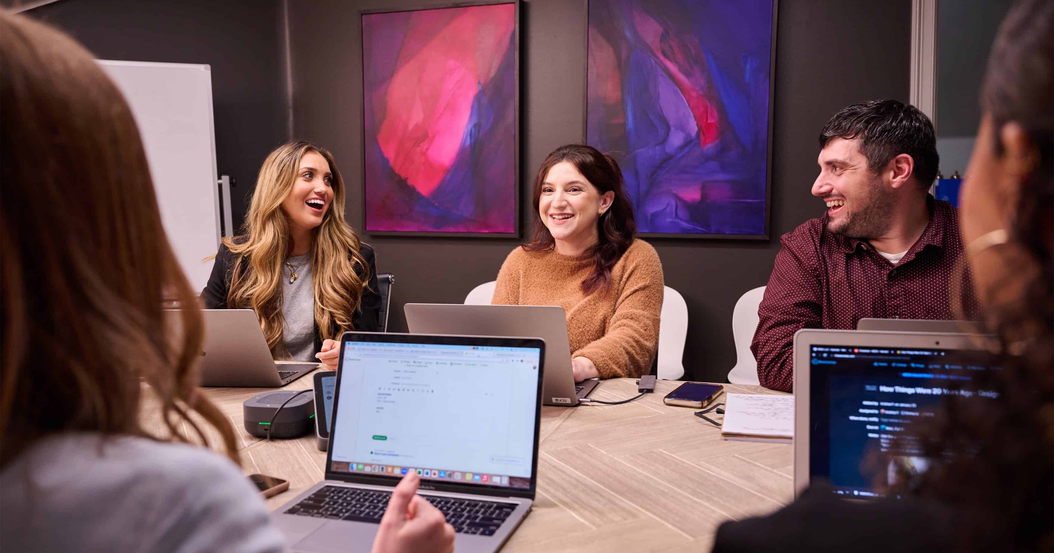 people sitting around a conference table working