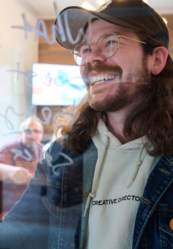 marketing team drawing on window