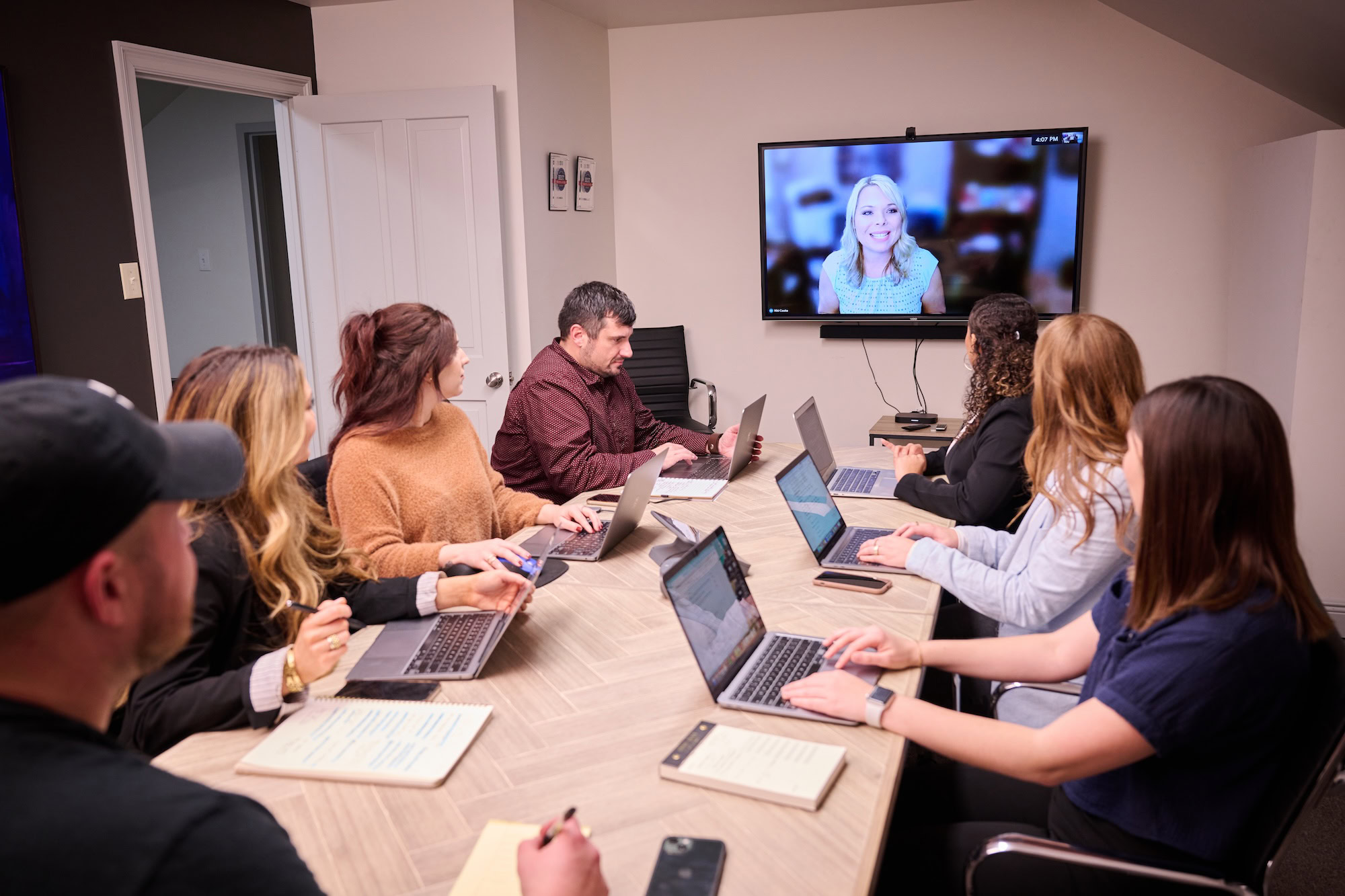 MESH employees meeting in a conference room