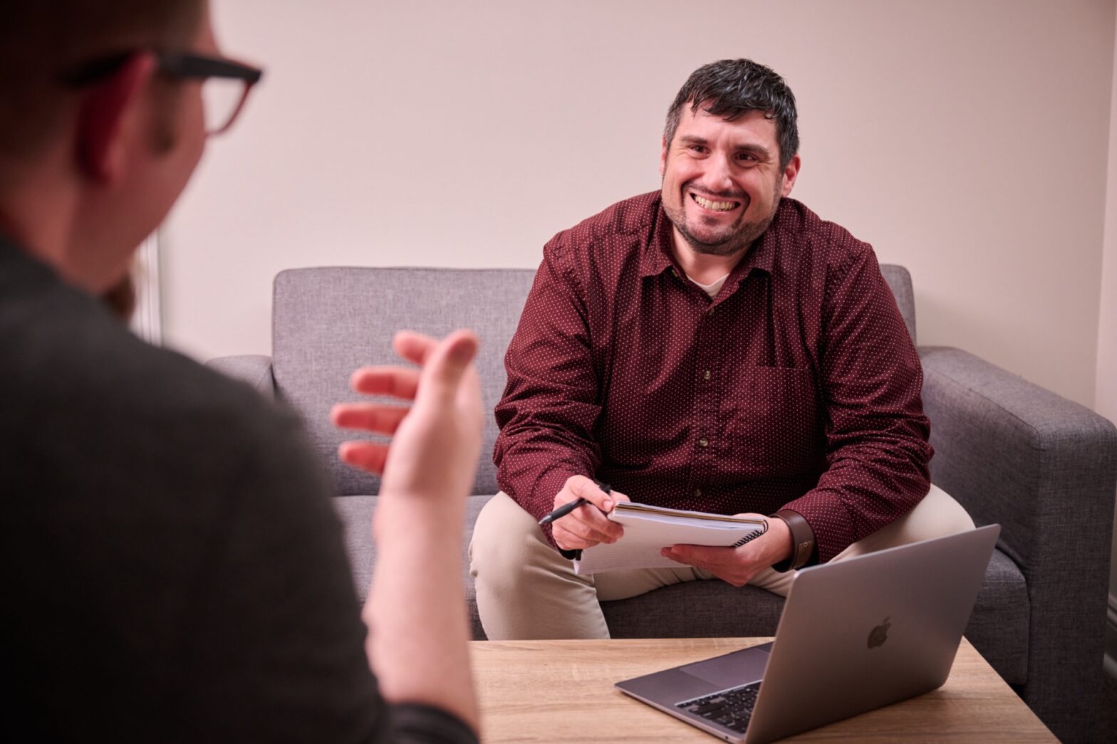 man sitting and smiling 